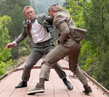 A screenshot from Skyfall showing James Bond fighting on a train