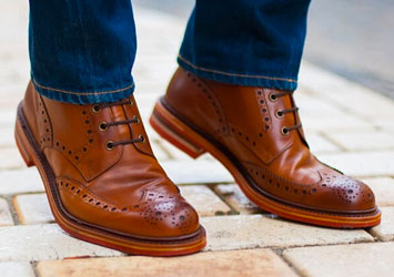 Brown wingtips and blue jeans
