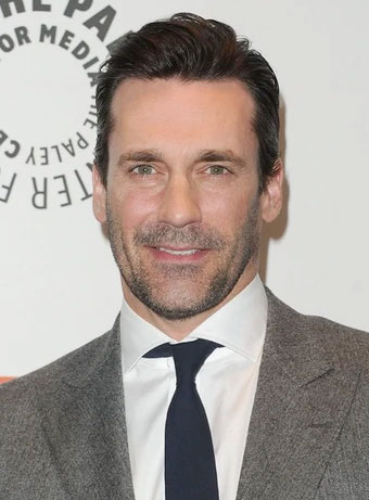 Jon Hamm with tapered hair and grey suit