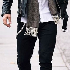 Man wearing pocket watch chain and leather jacket