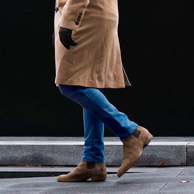 Man wearing beige Chelsea boots