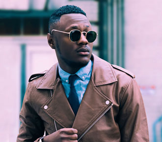 Young Black man with short cropped hair and sunglasses