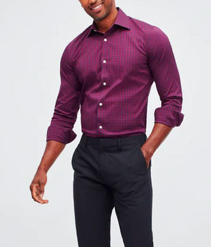 Man wearing burgundy colored shirt tucked into dark pants