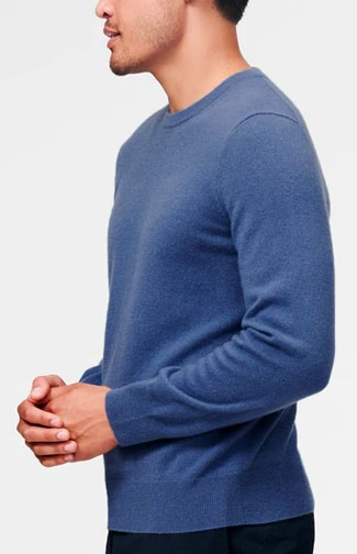The Naadam Cashmere Essential Sweater in blue shown from the side