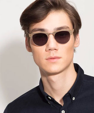 Man wearing wooden sunglasses