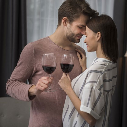 This or That Questions Dirty - Intimate couple holding wine glasses 