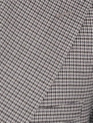 Close up of houndstooth pattern on suit