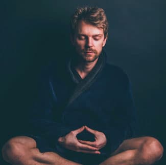 Bearded man meditating