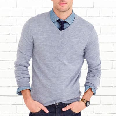 man wearing gray v-neck sweater