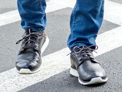 man wearing jeans and crossover shoes
