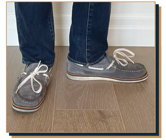 Dave Bowden wearing blue jeans and grey suede boat shoes from Allen Edmonds