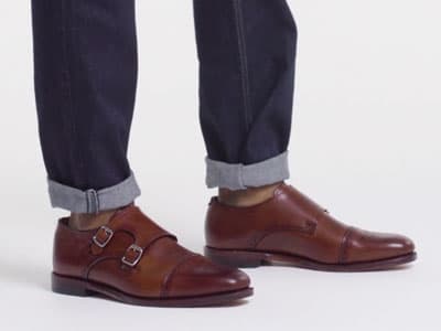 man wearing jeans and double monkstrap shoes