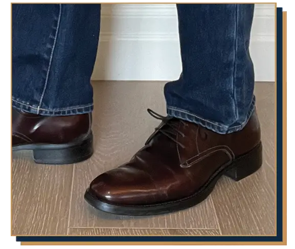 Dave Bowden wearing blue jeans and oxblood leather derby shoes