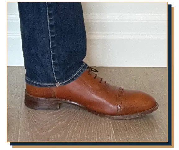 Dave Bowden wearing blue jeans and tan leather cap toe shoes from Beckett Simonon