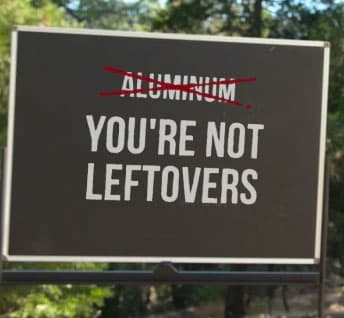 Sign with the word aluminum crossed out and the words You're Not Leftovers written in its place