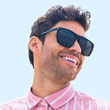 Man wearing EyebuyDirect sunglasses and pink shirt
