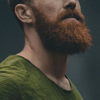 Handsome man with well grown beard of red hair