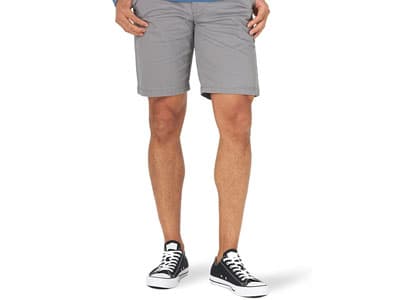 Man wearing shorts and canvas sneakers 