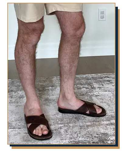 Dave Bowden wearing khaki shorts with leather slides