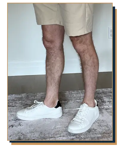 Dave Bowden wearing khaki shorts with white sneakers