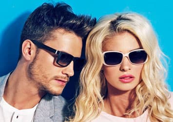A man and woman wearing stylish sunglasses 