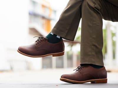 Man wearing khakis and derby shoes