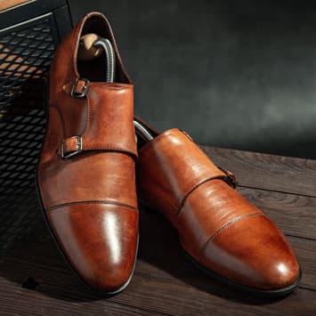 Brown leather monk strap shoes with shoe trees