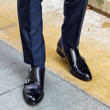 Man wearing black monk strap dress shoes