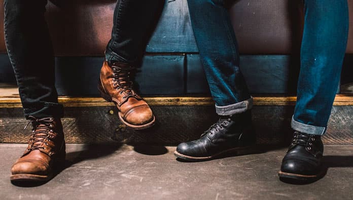 Legs and feet of two people wearing Red Wing Heritage boots 