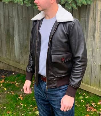 Man wearing leather aviator jacket