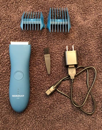 Meridian trimmer and accessories laid out on a towel