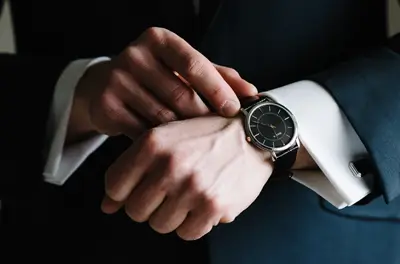Dave Bowden wearing a Bulova dress watch with a black dial on his wedding day
