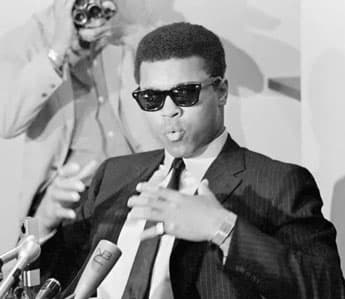 Muhammad Ali wearing black sunglasses