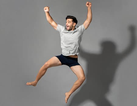 Man jumping in boxer briefs