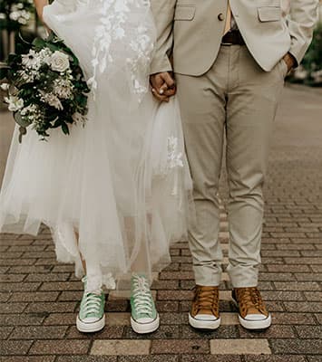 Bride and groom wearing Converse All-Stars