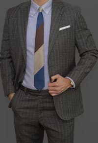 Man wearing grey pinstripe suit