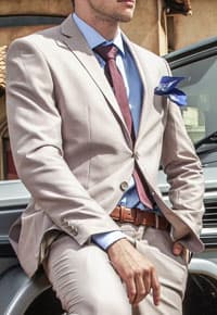 Man wearing beige suit