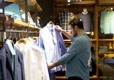 Young man shopping for clothes