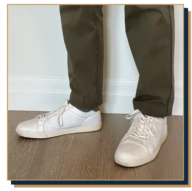 Irreverent Gent founder Dave Bowden modelling white sneakers with olive green chinos