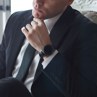 Man in suit wearing smartwatch