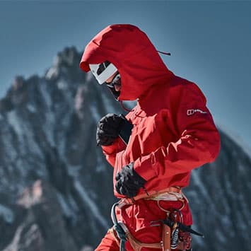 Man in the mountains wearing Berghaus snowsuit and gear