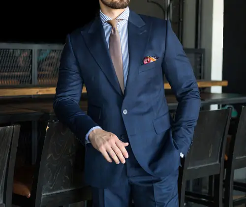 Man standing confidently in blue suit