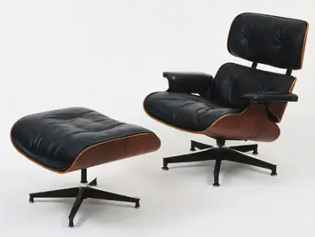 The original Herman Miller Eames lounge chair and ottoman, as pictured on the Museum of Modern Art website