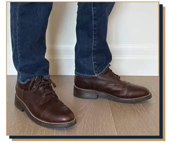 Dave Bowden wearing blue jeans and dark brown leather cap toe boots from Thursday Boot Company