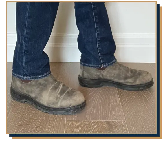 Dave Bowden wearing blue jeans and light brown chelsea boots from Blundstone