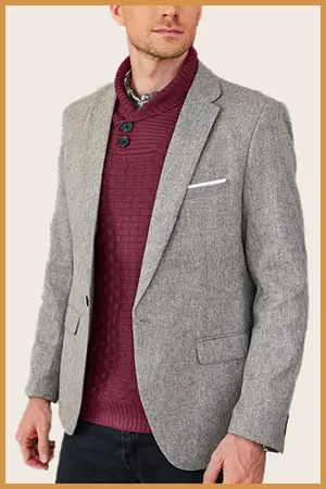 Man wearing a Burgundy shawl pullover under a blazer