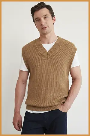 Man wearing camel sweater vest