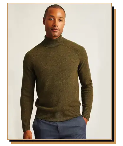 Man wearing an army green turtleneck sweater