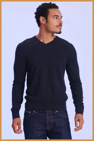 Man wearing a casual v-neck sweater and jeans