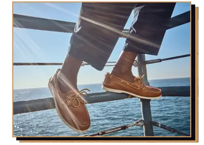 Man wearing sperry shoes on a pier